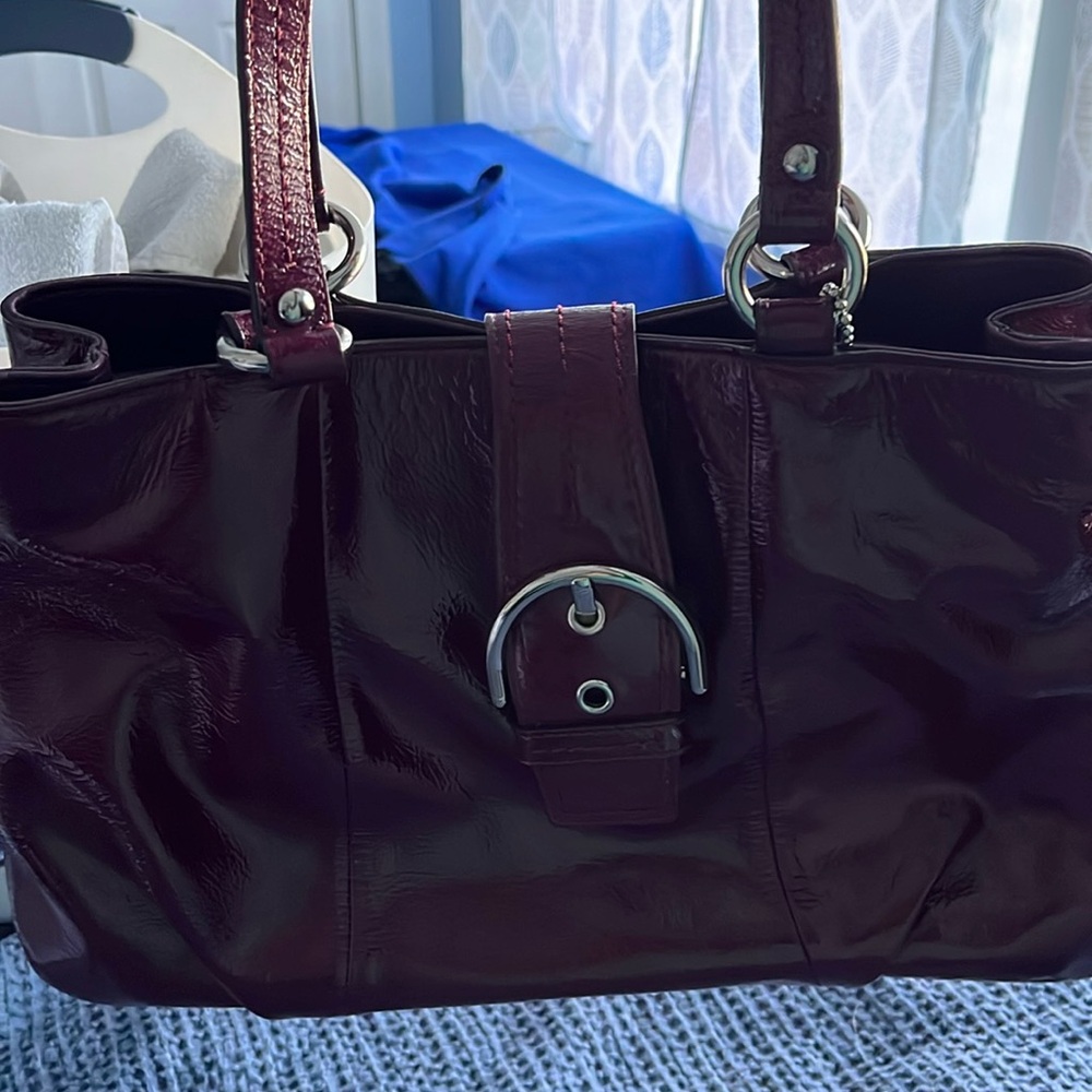 Coach SoHo soft plum patent leather shoulder bag.